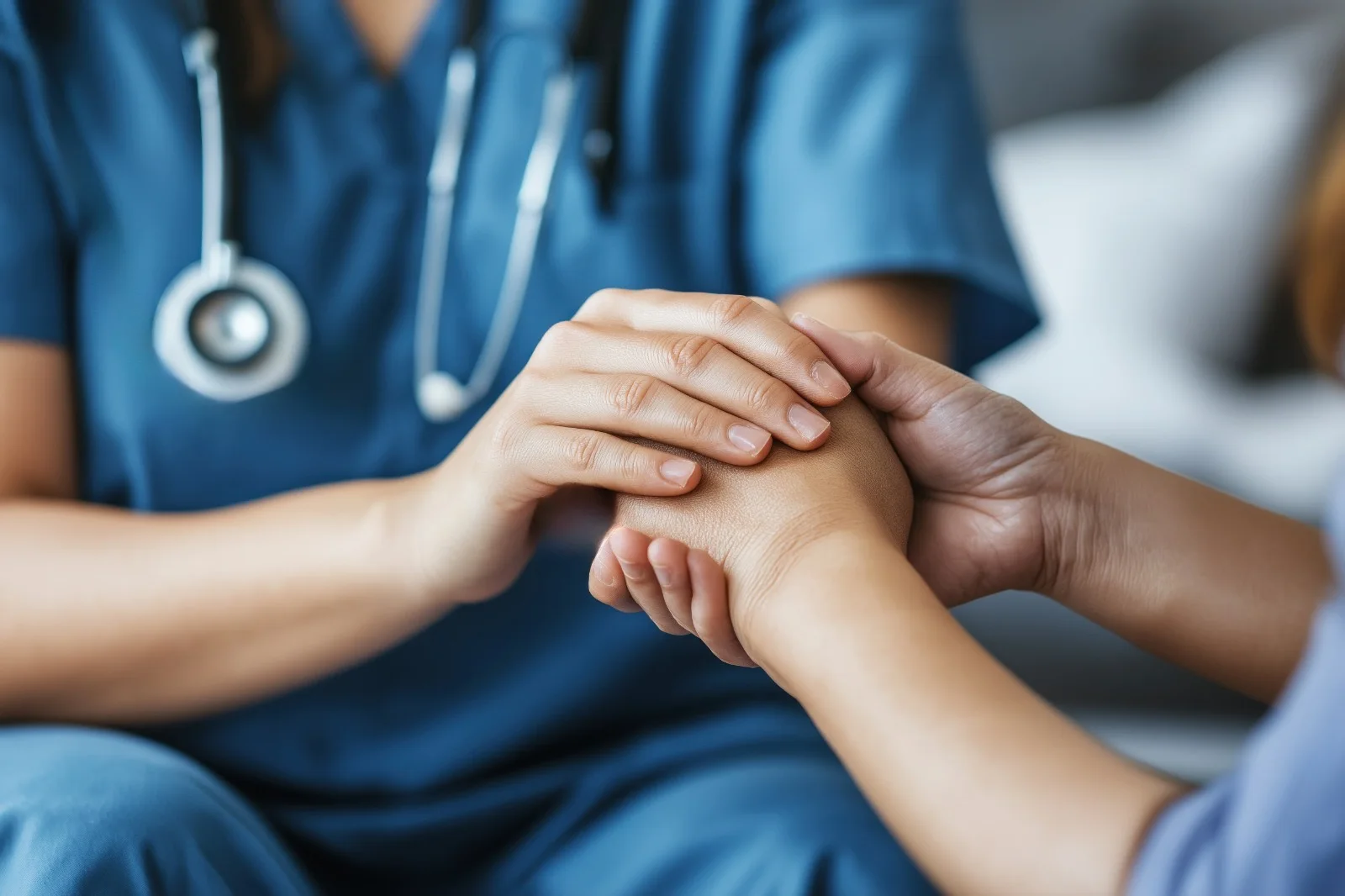 Nurse offering calm hands-on support during in-home recovery